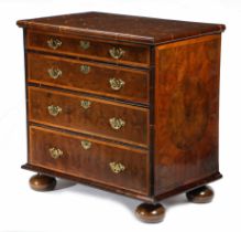 A WILLIAM AND MARY LABURNUM OYSTER VENEERED CHEST OF DRAWERS.