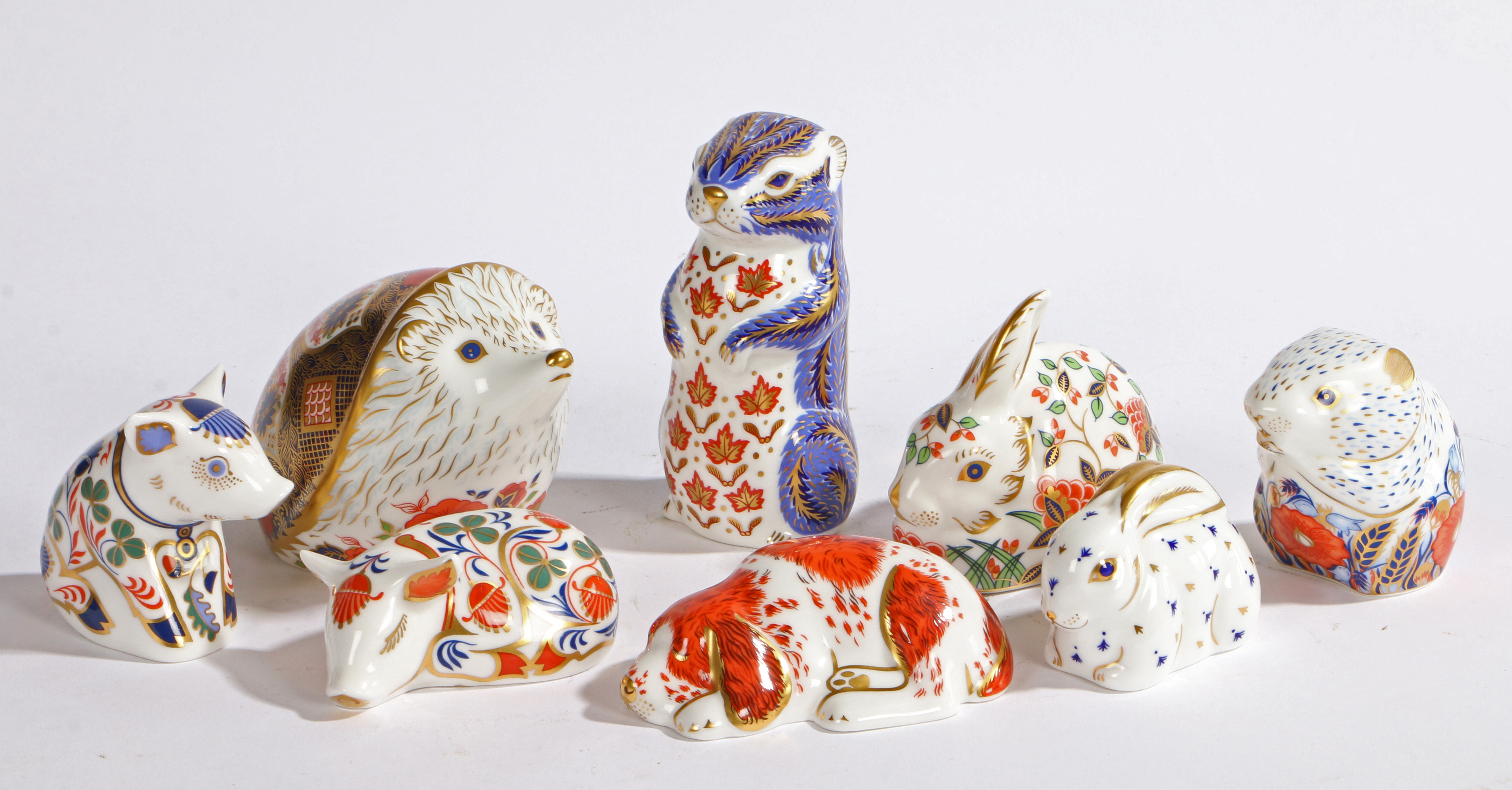 A GROUP OF EIGHT ROYAL CROWN DERBY PAPERWEIGHTS.