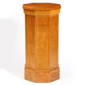 AN OAK PEDESTAL OF OCTAGONAL FORM.