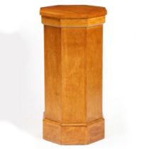 AN OAK PEDESTAL OF OCTAGONAL FORM.