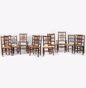 A SET OF TWELVE OAK EARLY 19TH CENTURY SPINDLE BACK CHAIRS.