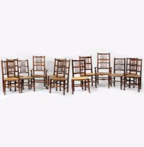A SET OF TWELVE OAK EARLY 19TH CENTURY SPINDLE BACK CHAIRS.