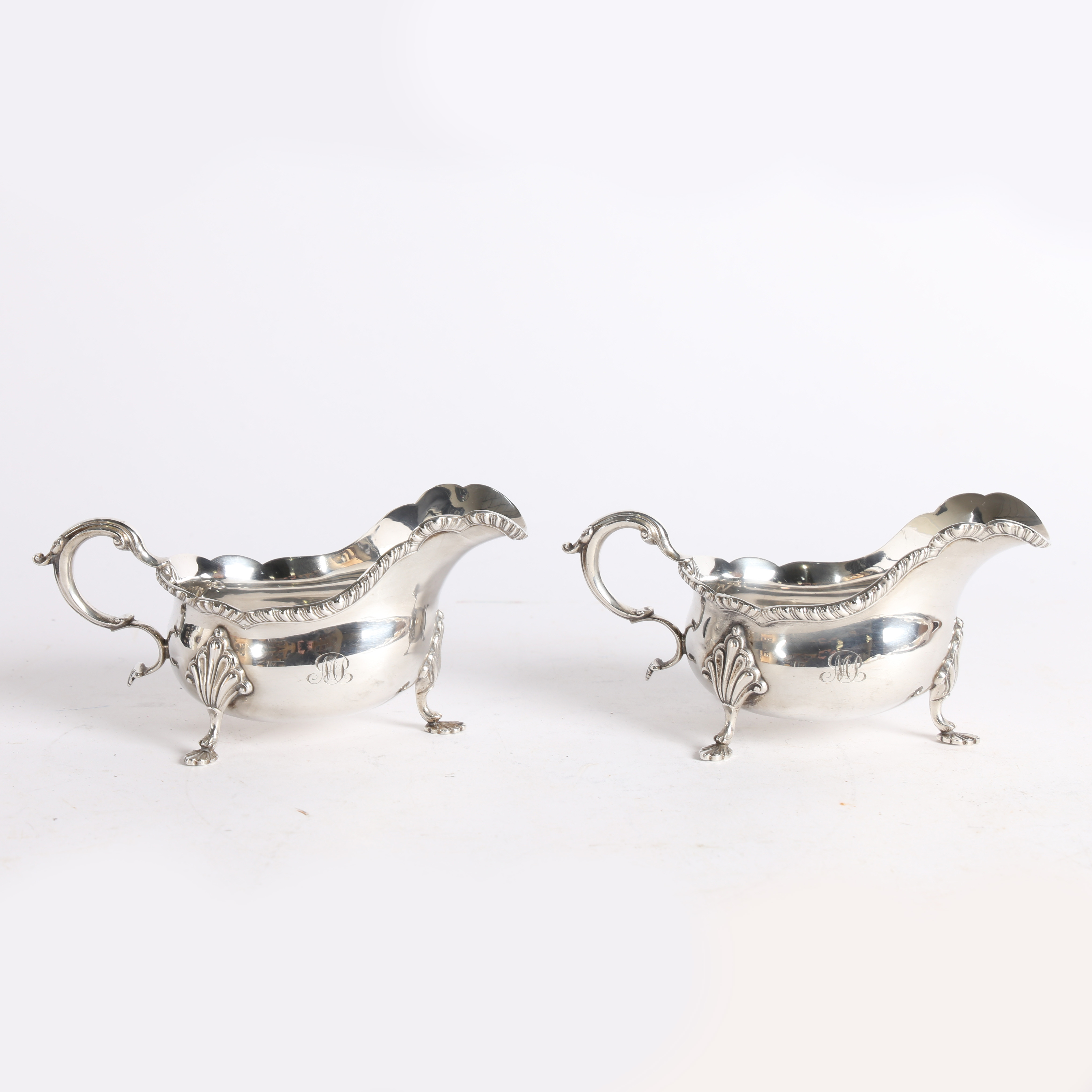 A PAIR OF GEORGE V SILVER SAUCE BOATS.