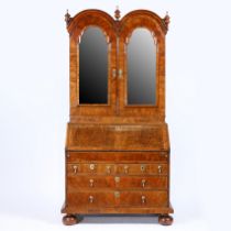 A GEORGE I WALNUT DOUBLE DOME BUREAU BOOKCASE.