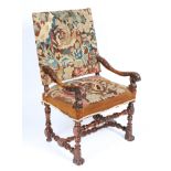 A 17TH CENTURY WALNUT ARMCHAIR.