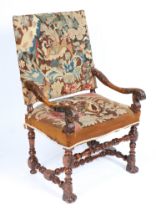 A 17TH CENTURY WALNUT ARMCHAIR.