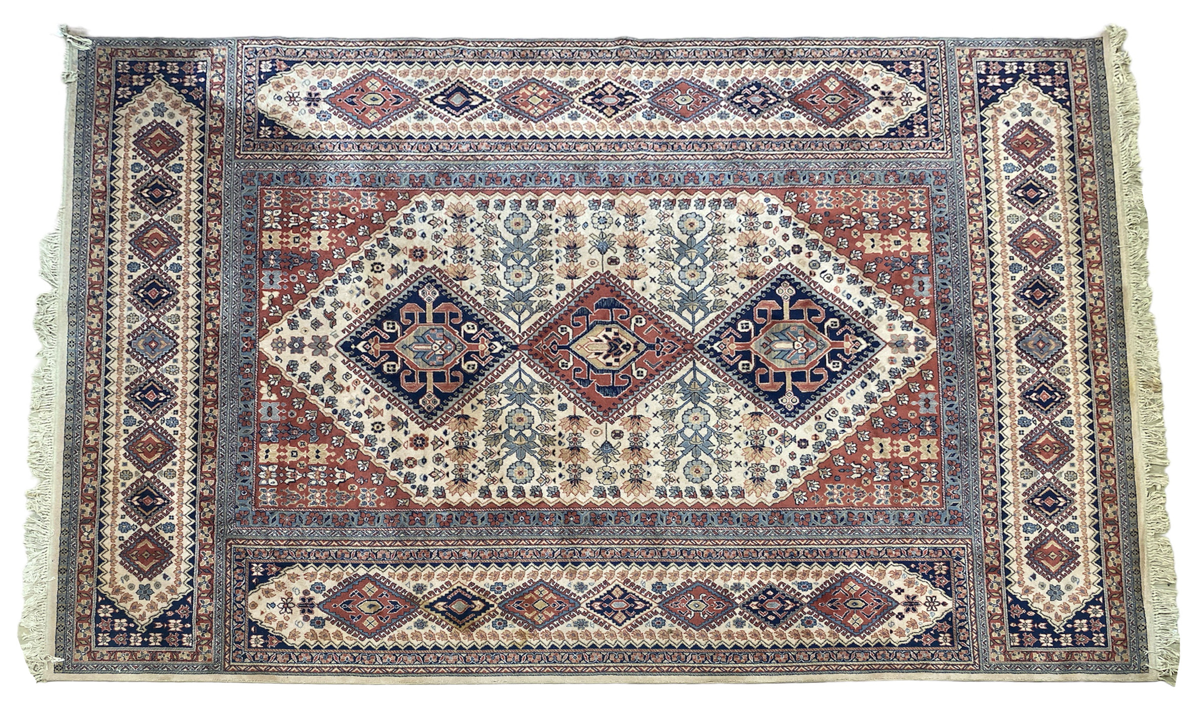 A LARGE KASHAN CARPET.