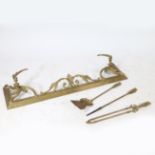 A 19TH CENTURY ROCOCO GILT BRASS FENDER AND MATCHING COMPANION SET.