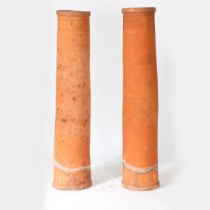 TWO SIMILAR 19TH CENTURY TERRACOTTA CHIMNEYS.