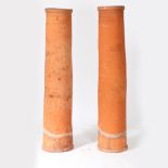 TWO SIMILAR 19TH CENTURY TERRACOTTA CHIMNEYS.