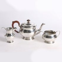 A GEORGE VI THREE PIECE SILVER TEA SET.