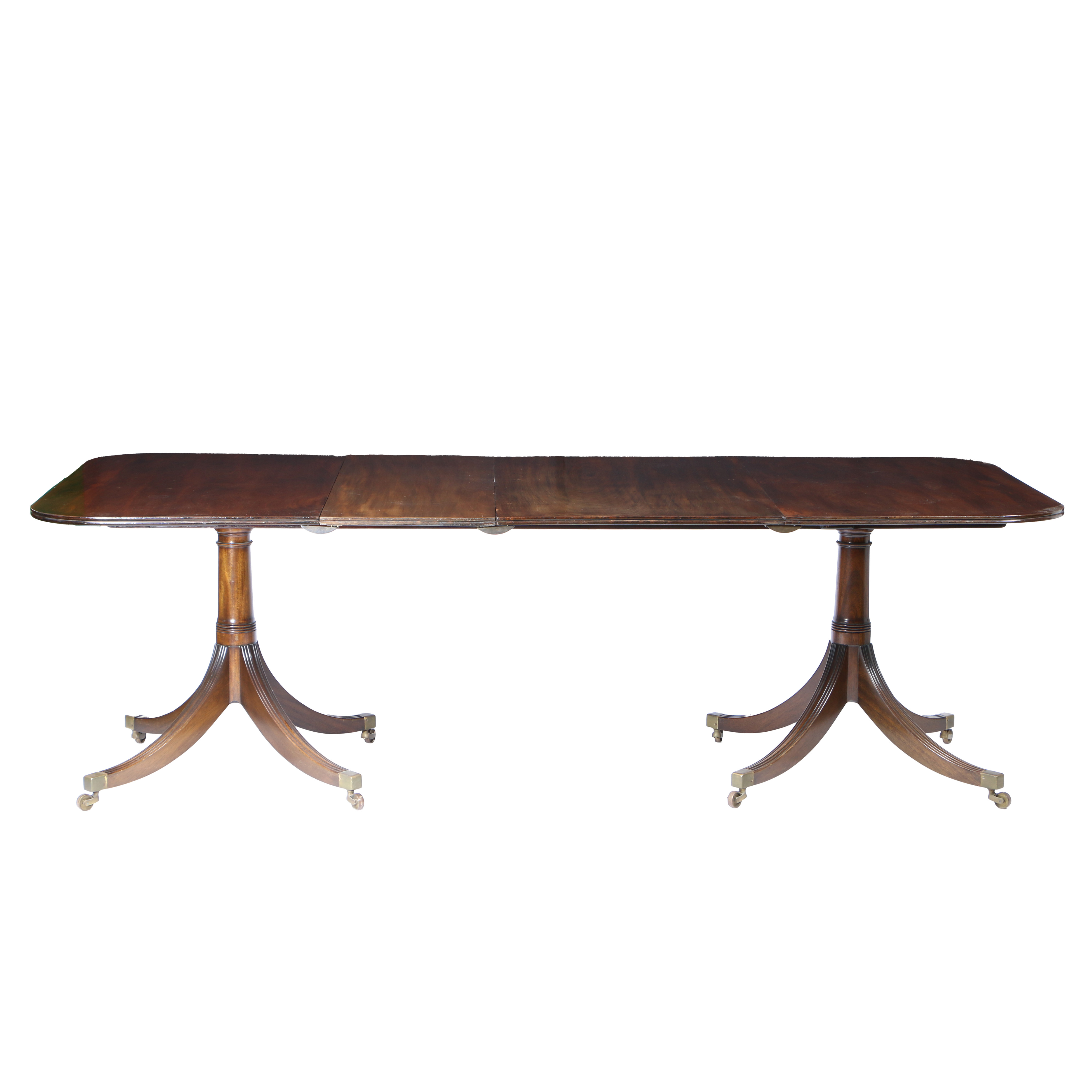 A REGENCY MAHOGANY TWIN PEDESTAL DINING TABLE.