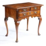 A GEORGE III WALNUT LOWBOY.