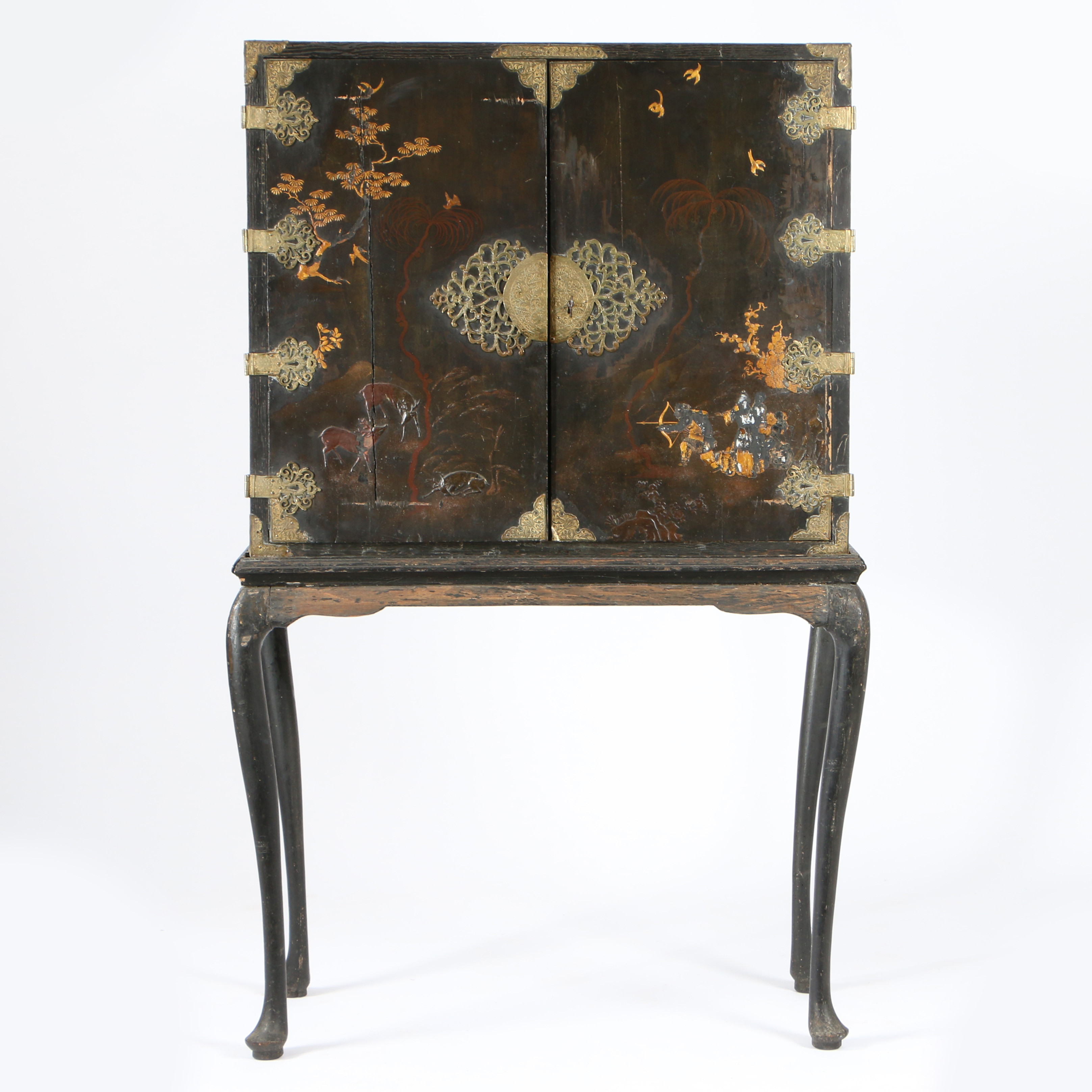 AN EARLY 18TH CENTURY JAPANESE EXPORT BLACK LACQUERED CABINET-ON-STAND, CIRCA 1720.