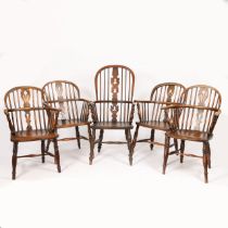A SET OF FIVE OAK AND ELM WINDSOR ARMCHAIRS.