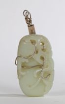 A CHINESE QING DYNASTY CELADON JADE PENDANT.