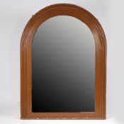 A LARGE LATE VICTORIAN MIRROR OF ARCHED FORM.