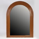 A LARGE LATE VICTORIAN MIRROR OF ARCHED FORM.