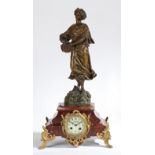 A LATE 19TH CENTURY PATINATED SPELTER AND ROUGE MARBLE MANTLE CLOCK.