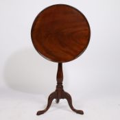 A GEORGE III MAHOGANY DISH TOP OCCASIONAL TABLE.