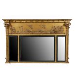 A REGENCY GILT GESSO OVERMANTLE MIRROR.