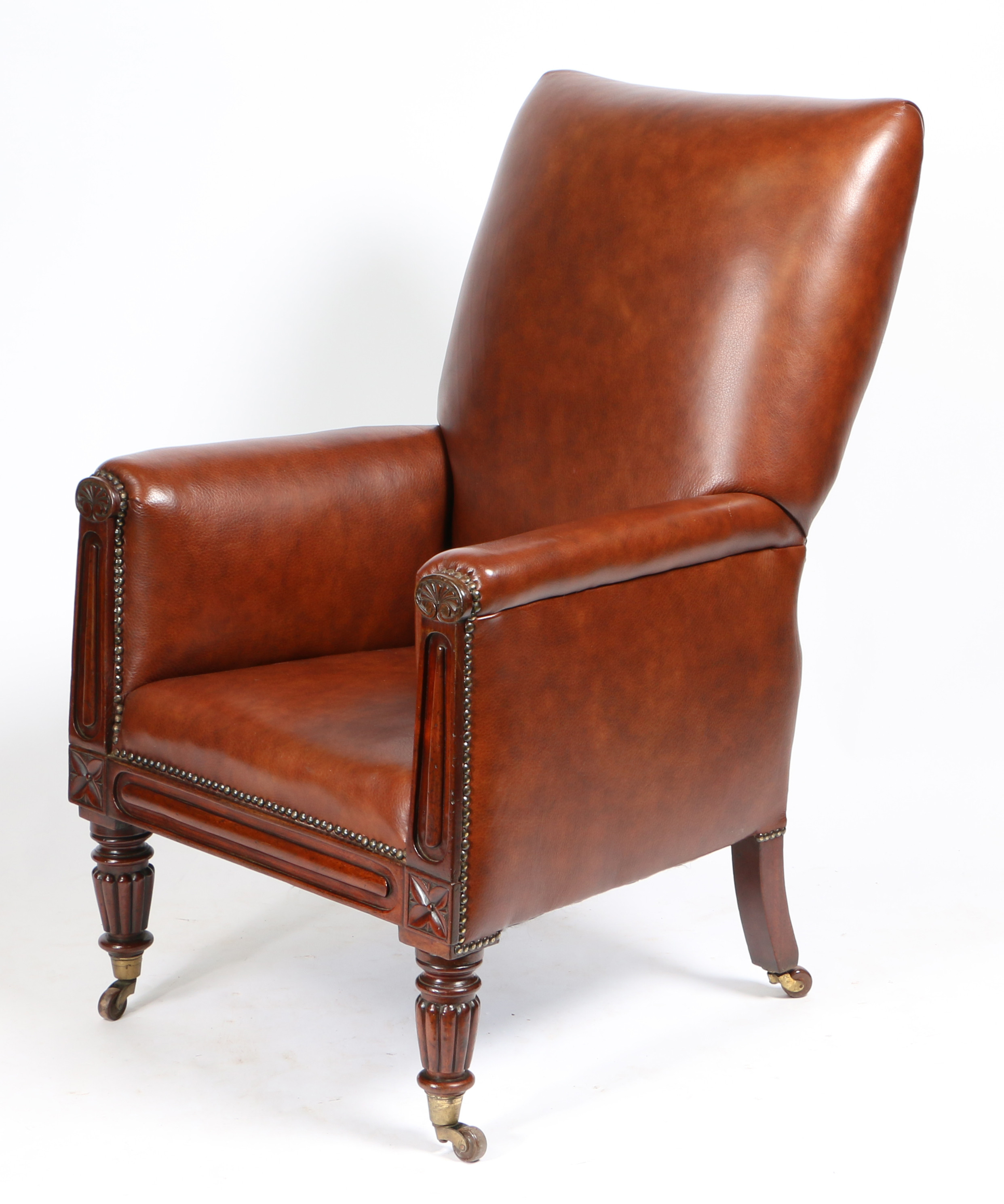 A 19TH CENTURY LEATHER UPHOLSTERED ARMCHAIR.
