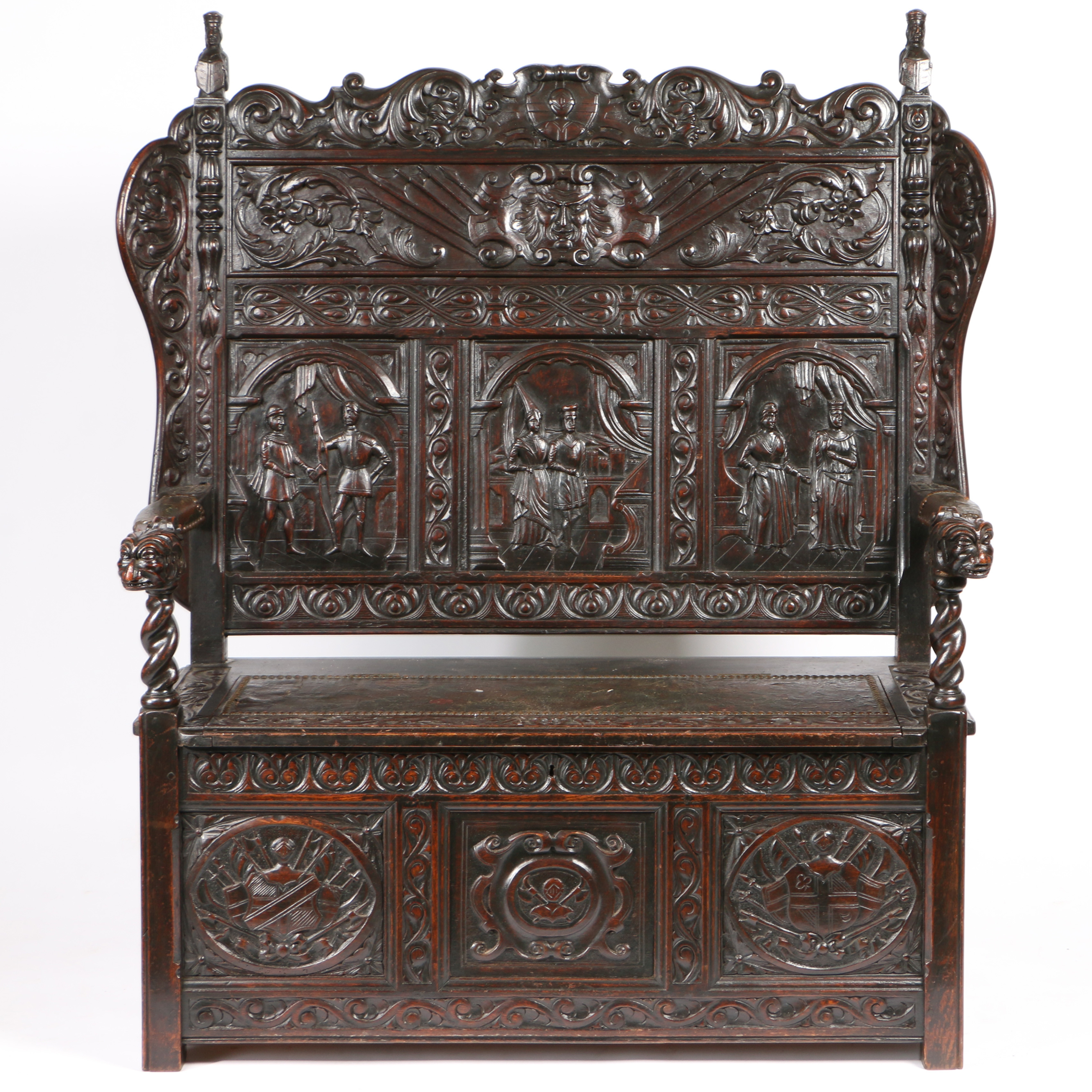 A 19TH CENTURY OAK SETTLE IN THE 17TH CENTURY MANNER.