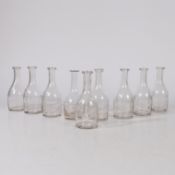 A NEAR SET OF NINE LATE 19TH CENTURY AMERICAN MEDICINE BOTTLES.