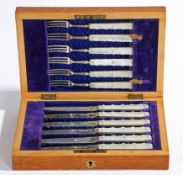 AN EDWARDIAN CASED SET OF SILVER AND MOTHER OF PEARL KNIVES AND FORKS.