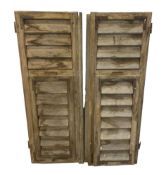 A PAIR OF VINTAGE FRENCH WINDOW SHUTTERS.
