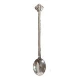 AN ARTS & CRAFTS SILVER HAMMERED LONG HANDLED SPOON.