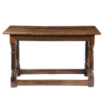 A 17TH CENTURY OAK TABLE.