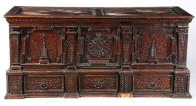 A GOOD MID-17TH CENTURY PINE/CEDAR CHEST, ORNATELY CARVED, STAINED AND DATED 1648.