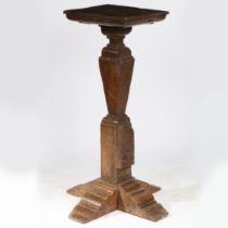 AN OAK PEDESTAL/TORCHÈRE STAND, TIMBERS CIRCA 1500-50 AND LATER.