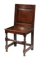 AN UNCOMMON CHARLES II OAK BACKSTOOL, CIRCA 1680.