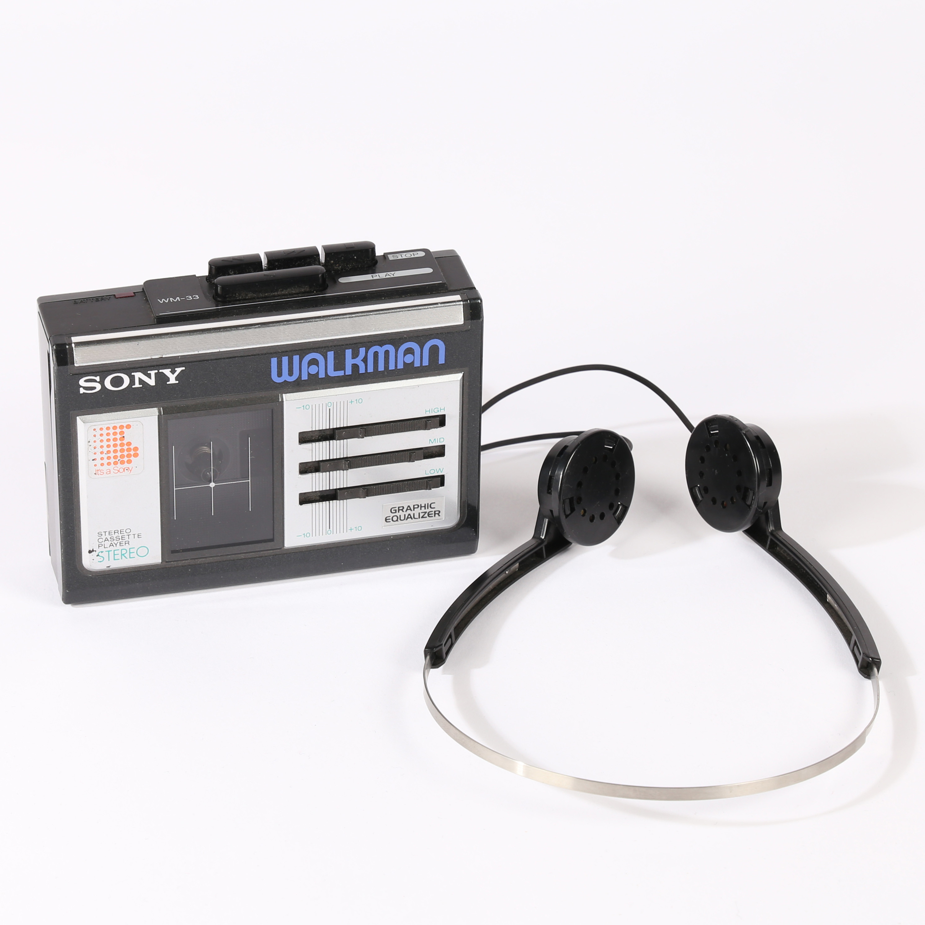 A SONY WALKMAN AND HEADPHONES.