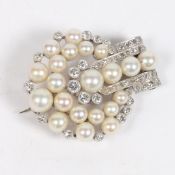 AN ART DECO DIAMOND AND PEARL BROOCH.