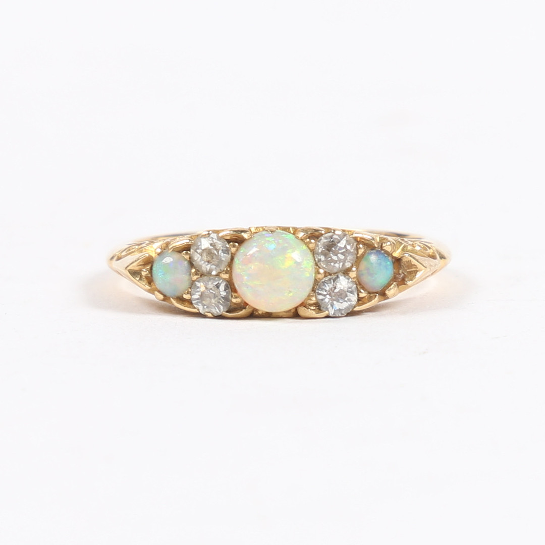 A VICTORIAN 18 CARAT GOLD, OPAL AND DIAMOND RING.