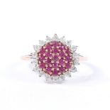 A YELLOW METAL, RUBY AND DIAMOND CLUSTER RING.