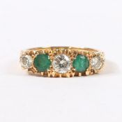 AN 18 CARAT GOLD, EMERALD AND DIAMOND RING.