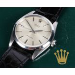 A ROLEX OYSTER PRECISION GENTLEMAN'S STAINLESS STEEL WRISTWATCH.