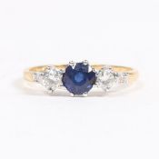 A YELLOW METAL, SAPPHIRE AND DIAMOND RING.