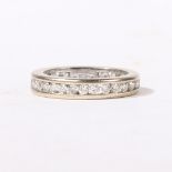 AN 18 CARAT WHITE GOLD AND DIAMOND FULL ETERNITY RING.