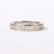 AN 18 CARAT WHITE GOLD AND DIAMOND FULL ETERNITY RING.