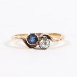 AN 18 CARAT GOLD, SAPPHIRE AND DIAMOND RING.
