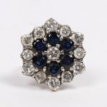 AN 18 CARAT GOLD, SAPPHIRE AND DIAMOND CLUSTER RING.