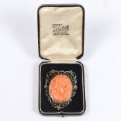 A SILVER GILT CORAL CAMEO BROOCH.