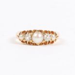 A YELLOW METAL, PEARL AND DIAMOND RING.