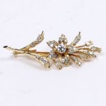 AN 18 CARAT GOLD AND DIAMOND BROOCH.