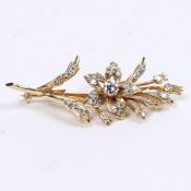 AN 18 CARAT GOLD AND DIAMOND BROOCH.